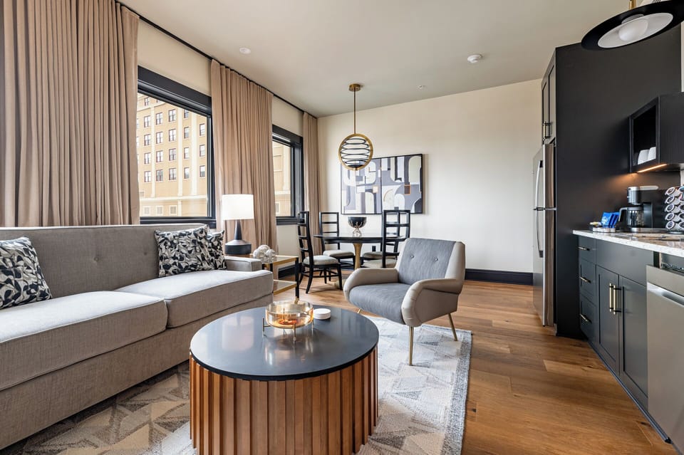 Chic and comfortable penthouse living room with statement decor filled with natural light.