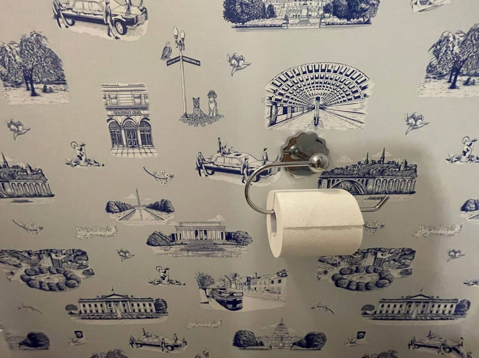 DC themed wallpaper in the main level half bath