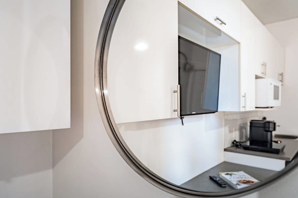 Sleek kitchen cabinets and a coffee maker for easy mornings during your stay.