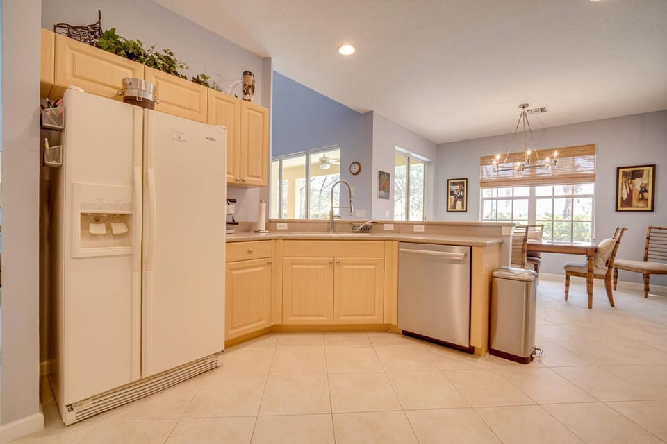 The spacious kitchen has full size appliances, including refrigerator/freezer, oven, microwave and dishwasher.