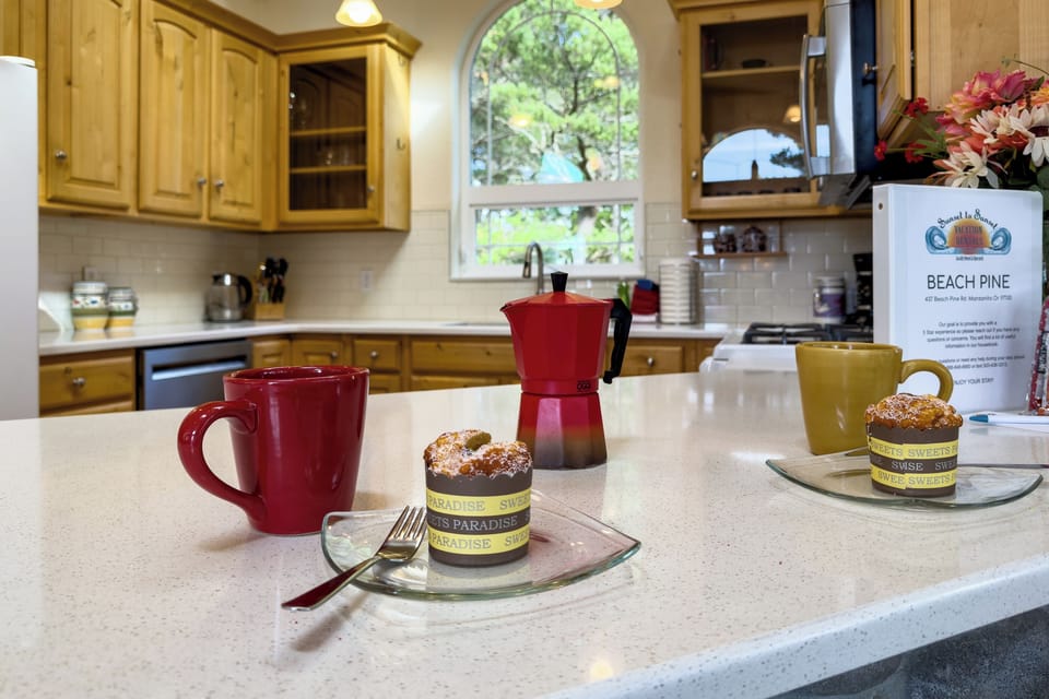Open living space with,Kitchen with breakfast bar, dining room and  Living room with Gas fireplace, Roku TV, and access to upper deck.