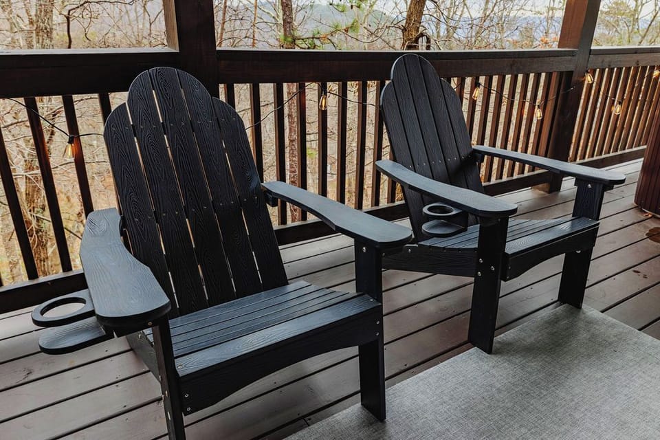 Find the two chairs at the end of the deck when you need five quiet minutes away from the group. String lights, a view, nothing else required.