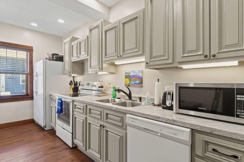 Fully equipped kitchen with modern appliances, ample counter space, and plenty of storage for a seamless cooking experience.