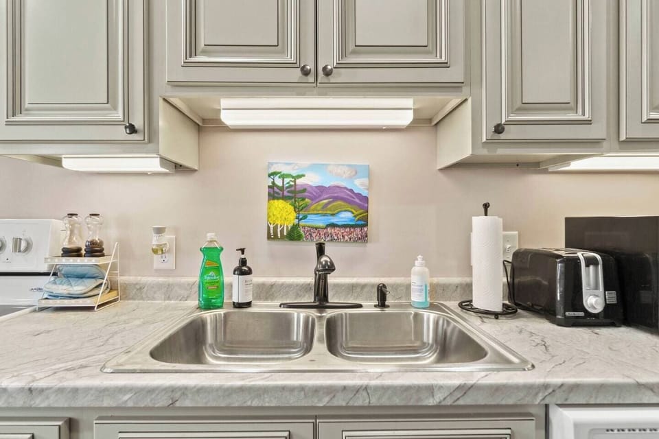 Spacious and spotless kitchen sink, designed for convenience and easy meal prep.