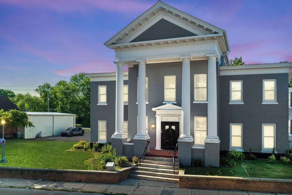 Charming exterior view of the front house, showcasing its historic architecture and inviting curb appeal.