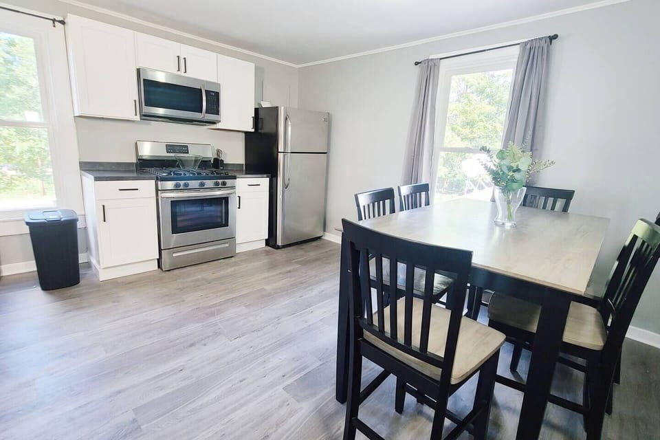 Stylish 6-seater dining area facing the kitchen, creating an open and inviting space perfect for meals and entertaining.