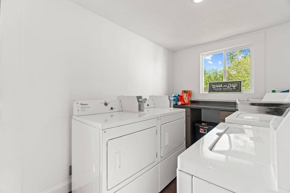 Convenient laundry room equipped with coin-operated machines, making it easy to keep your clothes fresh during your stay.