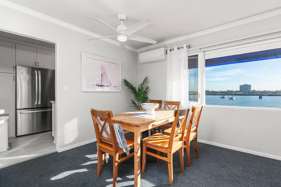 Dining area with seating for six people.  Apartment includes mini-split unit for AC, heating, and ceiling fan for air flow.  Stunning views from all main living areas.