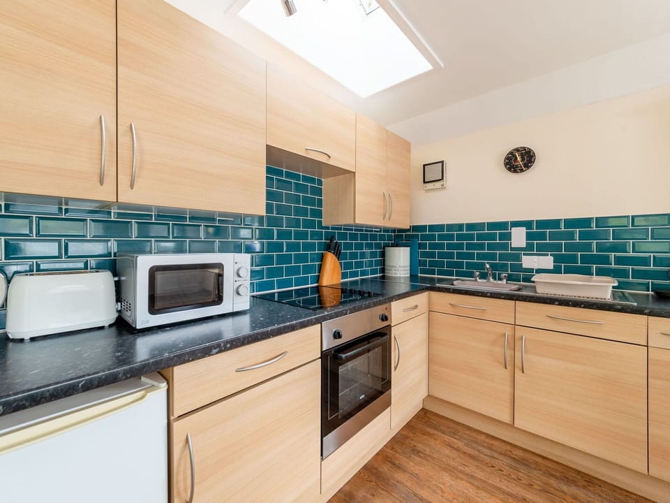 Countertop, Kitchen, Flooring, Interior Design, Major Appliance, Floor, Kitchen Appliance, Cabinetry, Tile, Plumbing Fixture