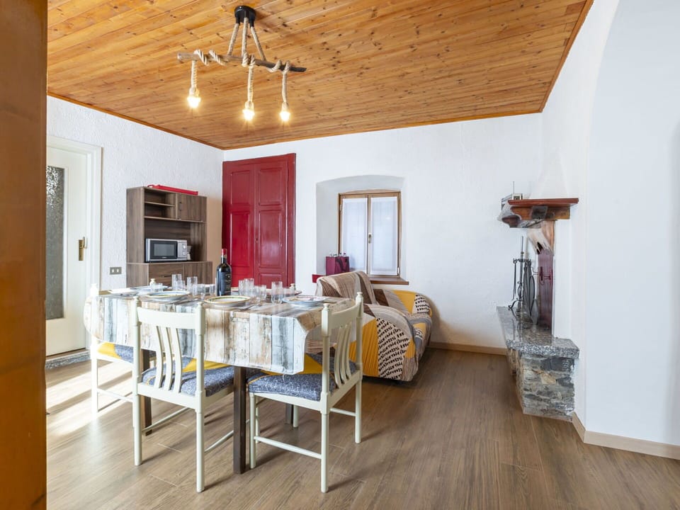 Property, Furniture, Picture Frame, Table, Wood, Interior Design, Ceiling Fan, Living Room, Flooring, Beam