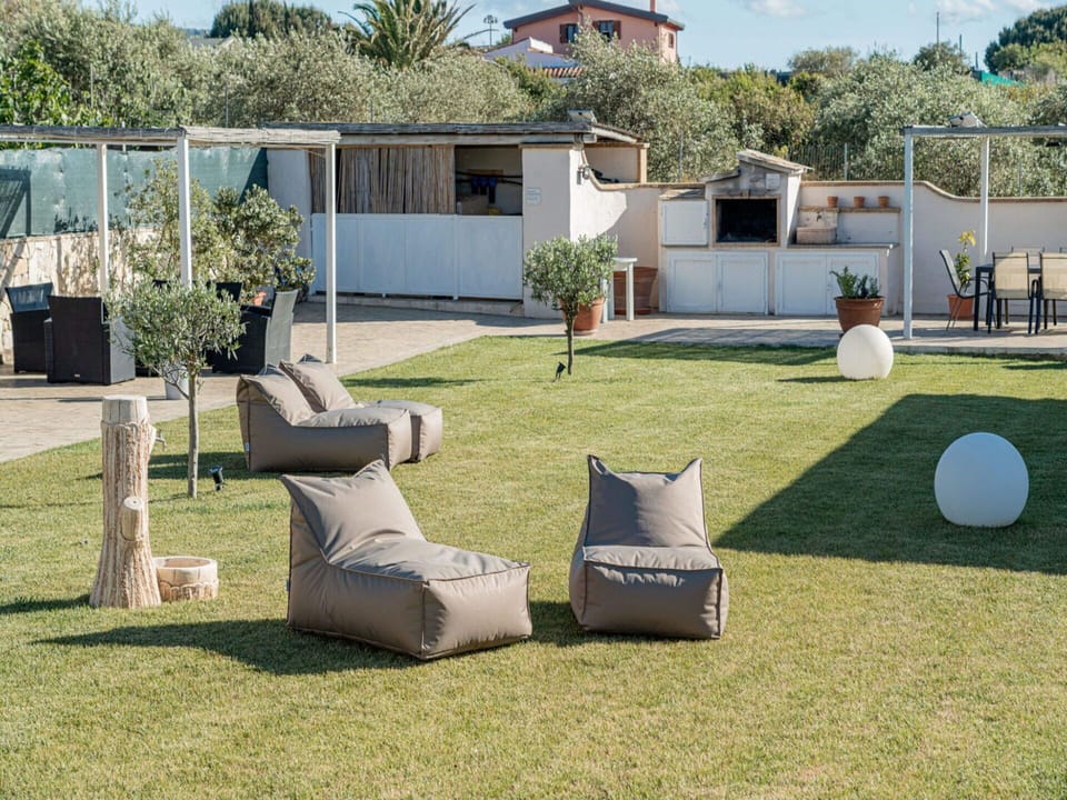 Plant, Property, Building, Sky, Shade, Land Lot, Tree, Architecture, Grass, Outdoor Furniture