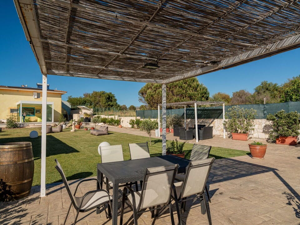 Plant, Property, Sky, Table, Shade, Flowerpot, Building, Chair, Tree, Outdoor Furniture