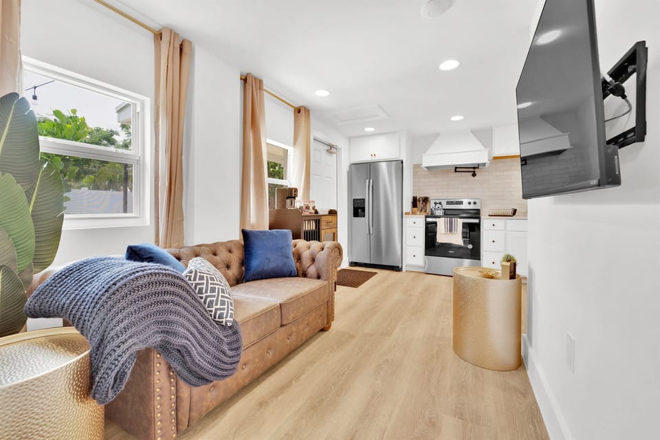 View of back unit 0 living room with comfortable couch and a Smart TV