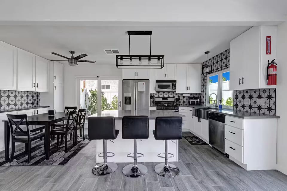 Kitchen w/ Island & Dining Room Table