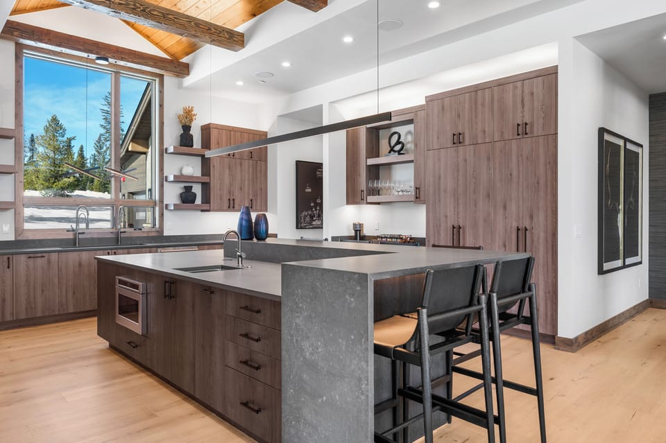 Kitchen is truly a one of a kind state of art...  Bar seating for 6. 2 sinks, GE Monogram appliances, filtered water, coffee bar, walk-in hidden pantry , storage beyond what you will need.  In ceiling speakers as well.  