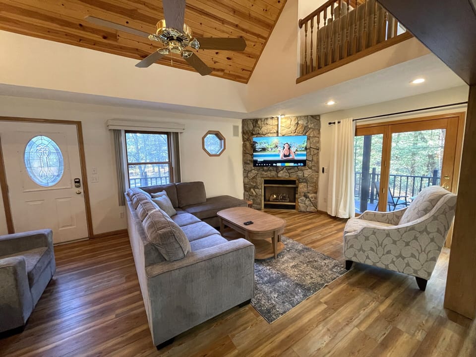 Living Room with Cozy Seating, Queen Sofa Sleeper, TV & Fireplace