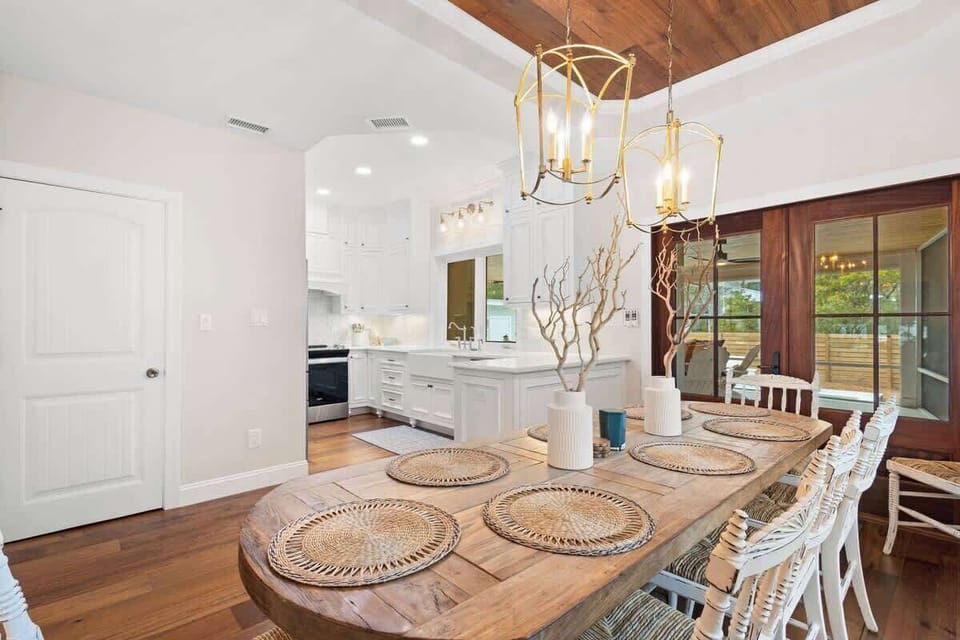 Dining room features a walkout to the large screened in porch.