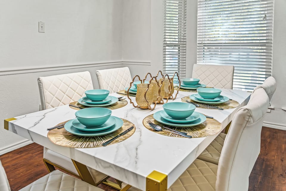 “Chic dining table setup with elegant tableware and natural lighting.”