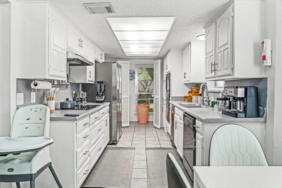 “Modern kitchen with full appliances, ample space, and natural light.”