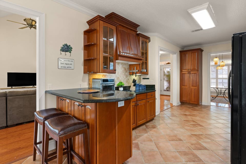 The large kitchen also features a bar with stools so you can relax with a drink and appetizer while you watch someone else cook for a change.