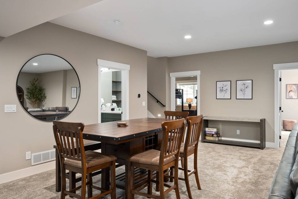 With a fireplace, ample seating, and a bar set up this room is perfect for a game night!
