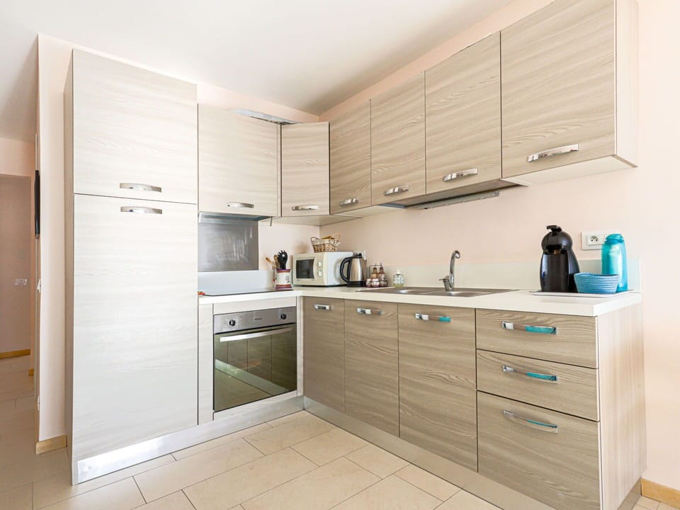 Cabinetry, Kitchen, Countertop, Kitchen Appliance, Major Appliance, Wood, Furniture, Interior Design, Flooring, Cupboard