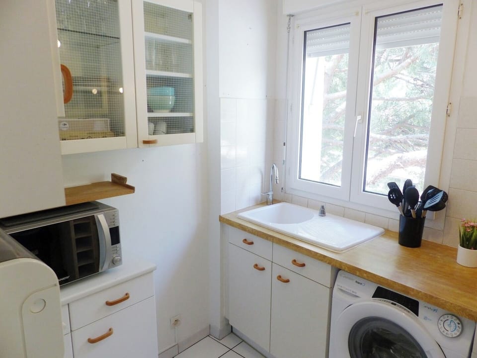 Cuisine avec machine à laver