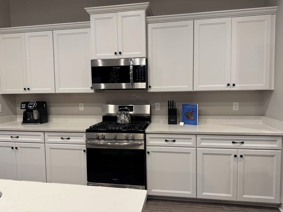 This kitchen invites you to cook, chat, and gather around the island—a warm and welcoming space for any meal. More photos on the way