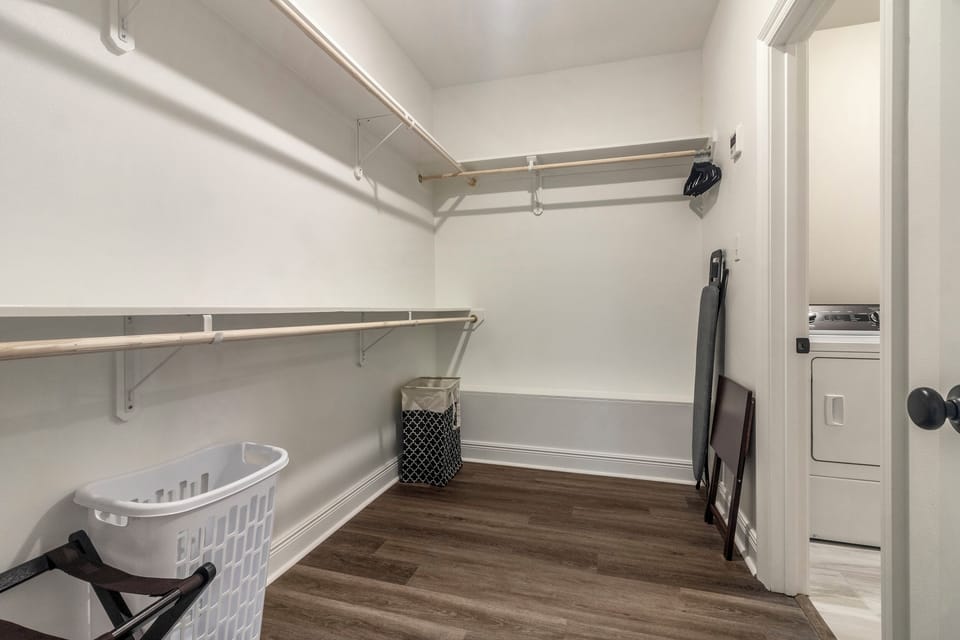 Stay organized with a spacious walk-in closet at this pet-friendly and best Airbnb in Lake Charles. With ample storage and direct access to the laundry room, it's designed for convenience and comfort.