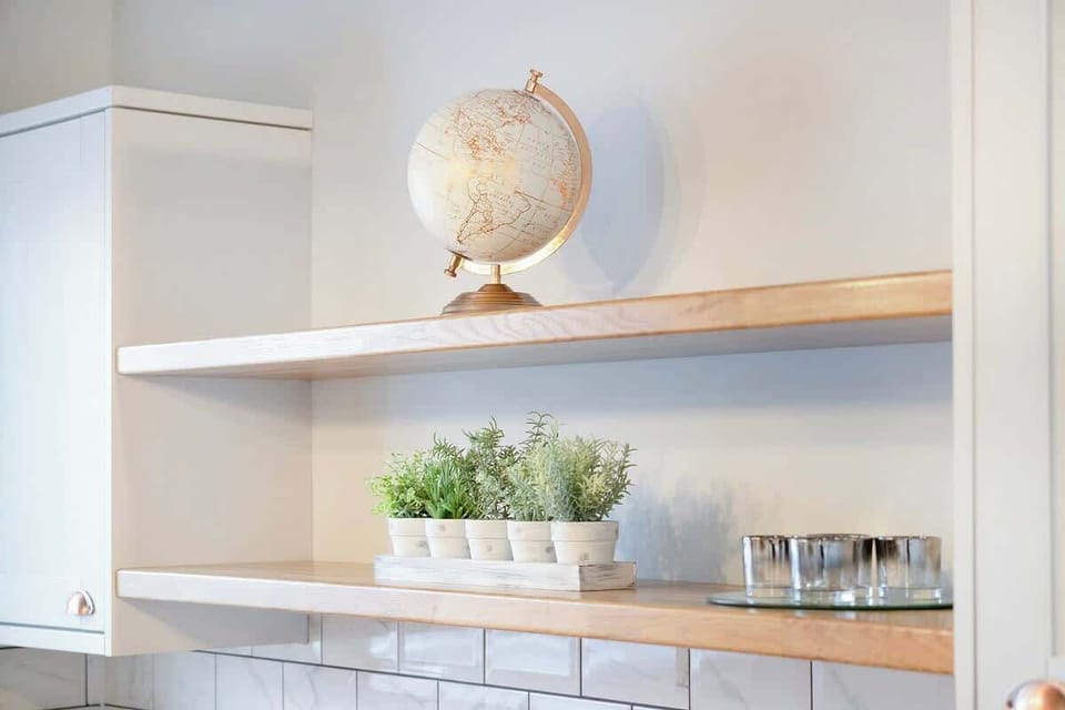 Kitchen equipped with all essentials, including a washer & dryer, oven, fridge and full cookware set.