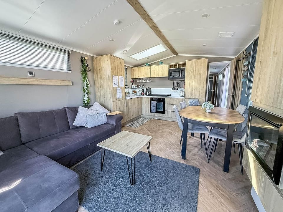 Whether you're planning a dog-friendly short break or a static caravan holiday, the living room of a caravan at Broadland Sands Holiday Park Lowestoft offers a welcoming space to unwind.