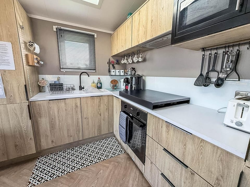 Plan your dog friendly weekend breaks at Park Holidays UK Broadland Sands, where the kitchen area in a caravan allows you to prepare meals for the whole family, including your furry friend, after a day at Suffolk beaches.