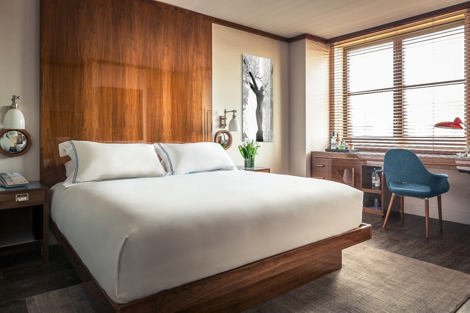 Wake up refreshed in a sunlit room with skyline views.