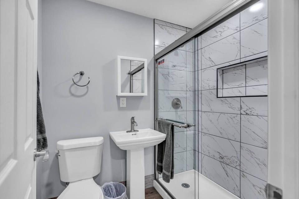 Modern bathroom with marble-style shower