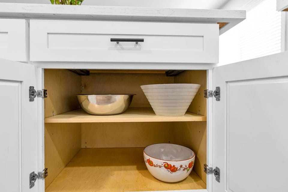 Clean interior storage with bowls and shelving.
