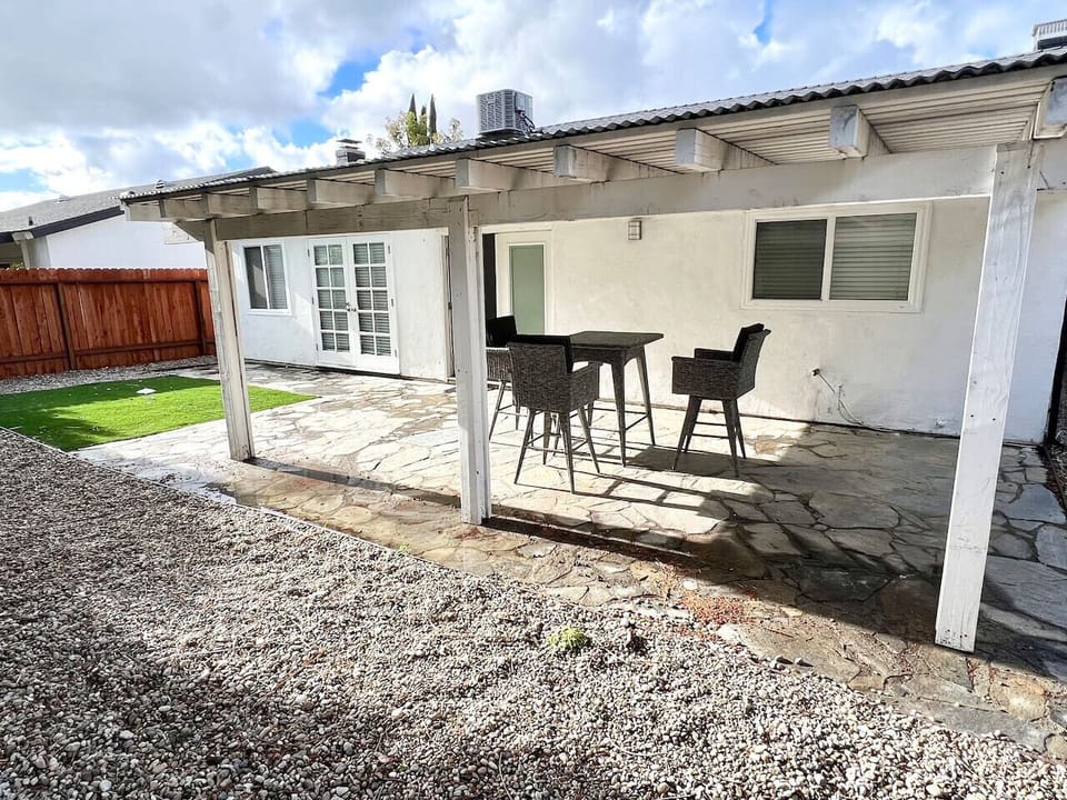 Shaded patio with outdoor dining set