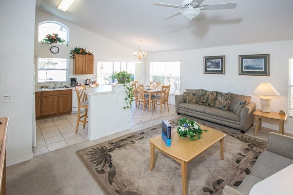 Lounge, dining room and kitchen with high counter seating
