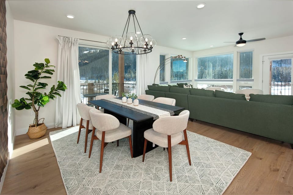 Beautiful dining room with large wood table and seating for up to 6 people.