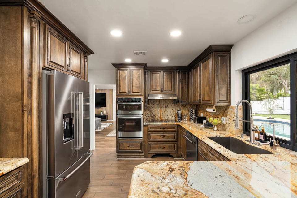 A modern, well-equipped kitchen designed for culinary creativity, featuring top-of-the-line appliances and ample counter space.