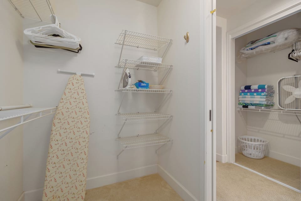 Walk in closet is in the primary bedroom, there is another closet across the hall where you see extra beach towels.