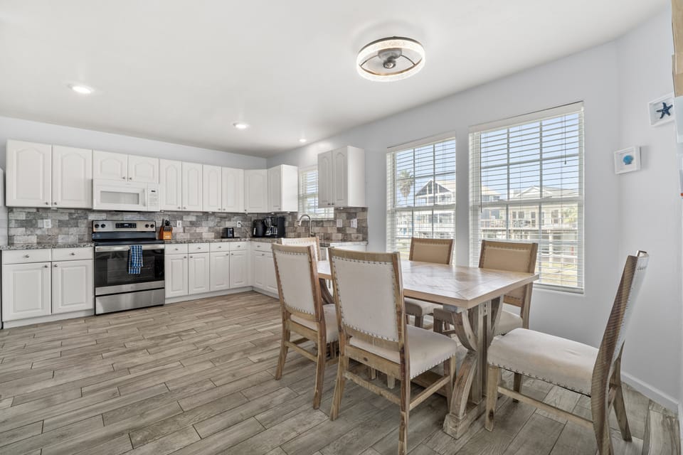Open concept kitchen with dining room table.