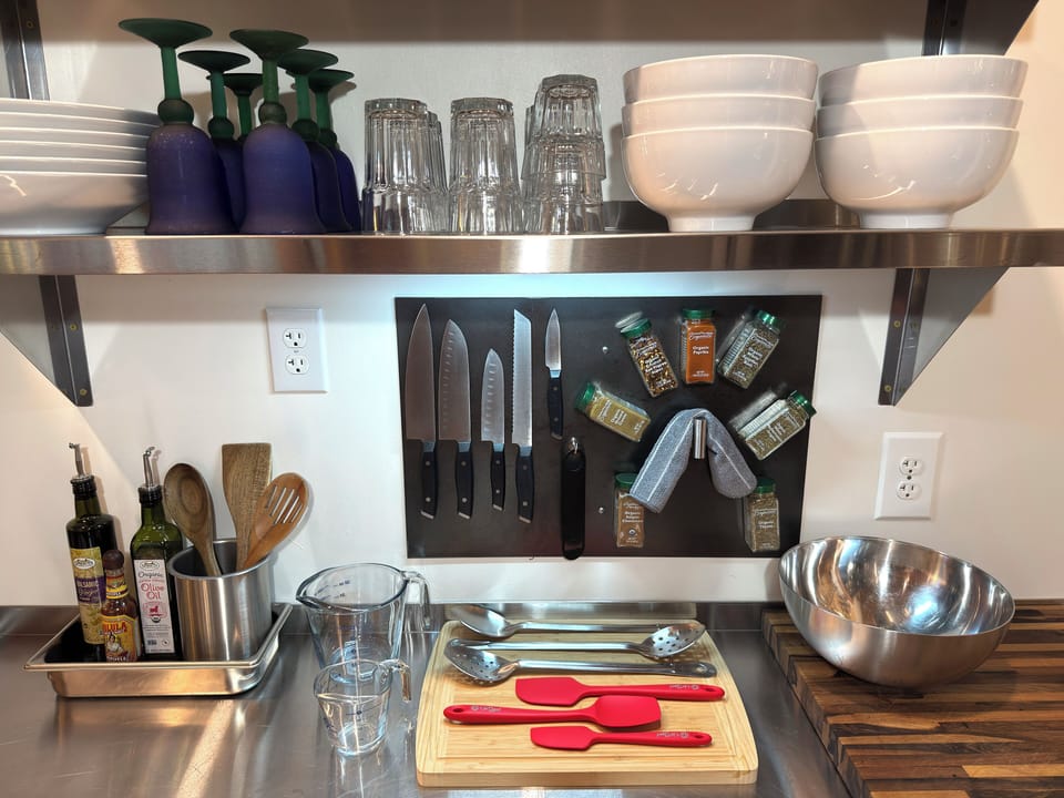 Chef's knife set, spices, cooking utensils and cutting boards.