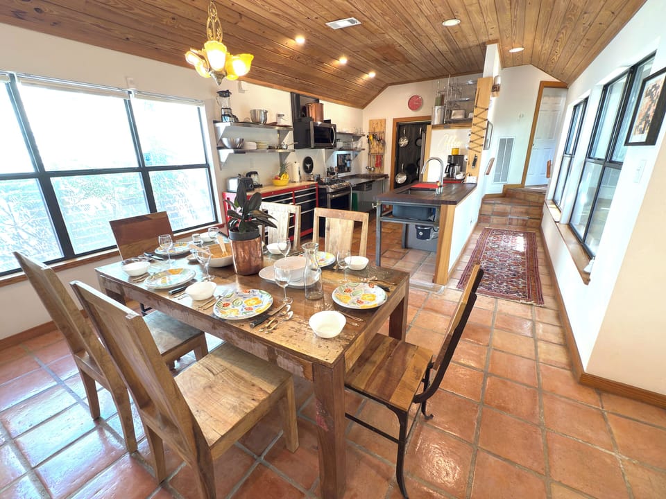 Vaulted dining room for 6 opens seamlessly to kitchen