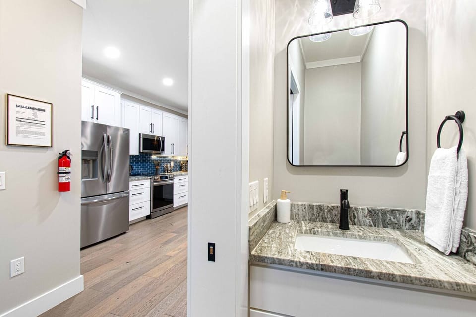 Powder room, located right off the front door entry