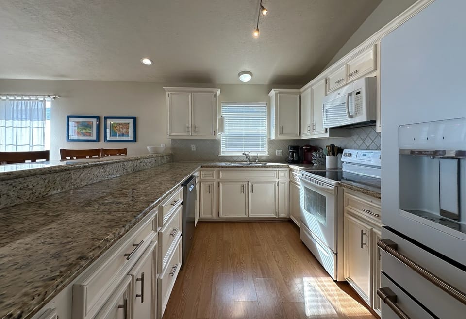 Large fully stocked kitchen.  Separate drink fridge right outside the kitchen.