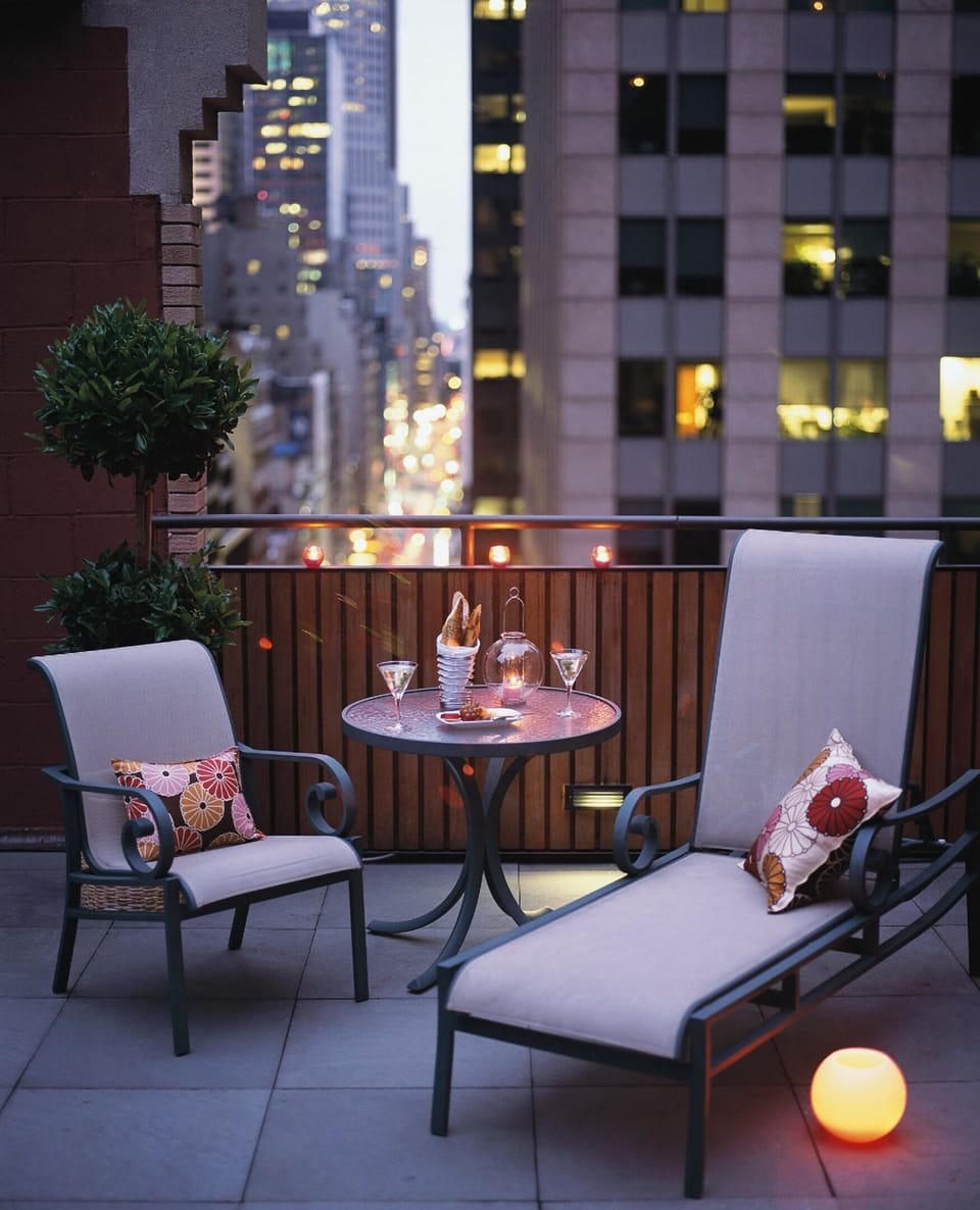 Toast the night on your terrace above the city buzz.