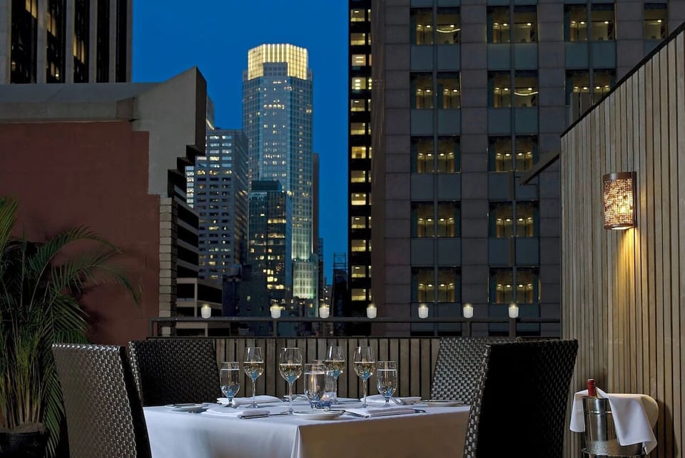 Unwind under city lights with rooftop dining and skyline views.