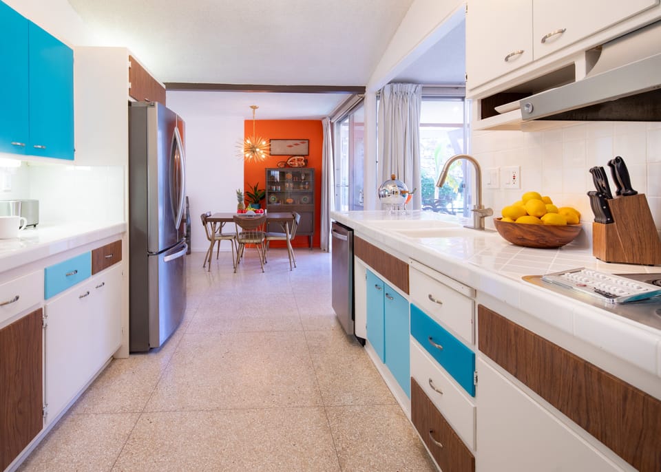 Kitchen with stainless steel appliances & functioning vintage cooktop