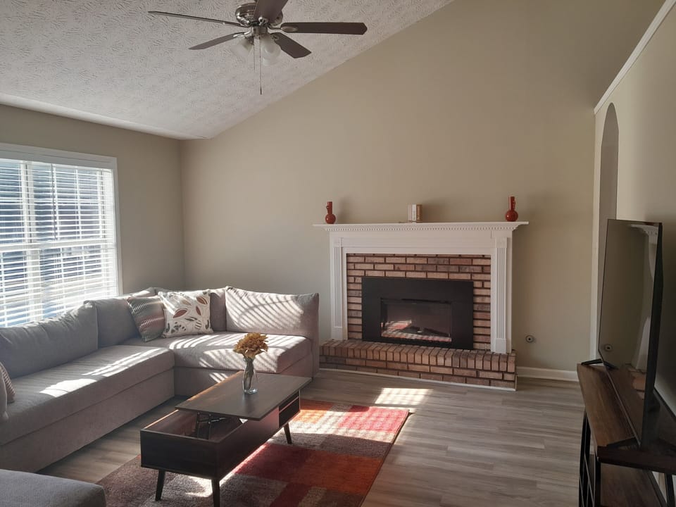 Living Room with sectional, Lounge chair, Fireplace  and 55in smart TV