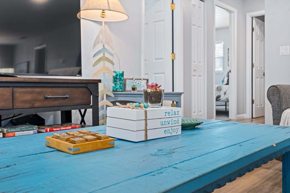 The living room decor is a warm and welcoming space designed for comfort, convenience, and togetherness.